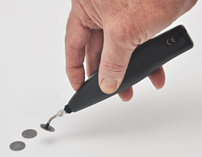 Holding the Battery Powered Vacuum Pick-up Tool